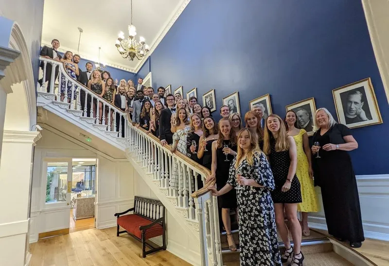 A photo of St John's alumni gathering on the Haughton staircase.