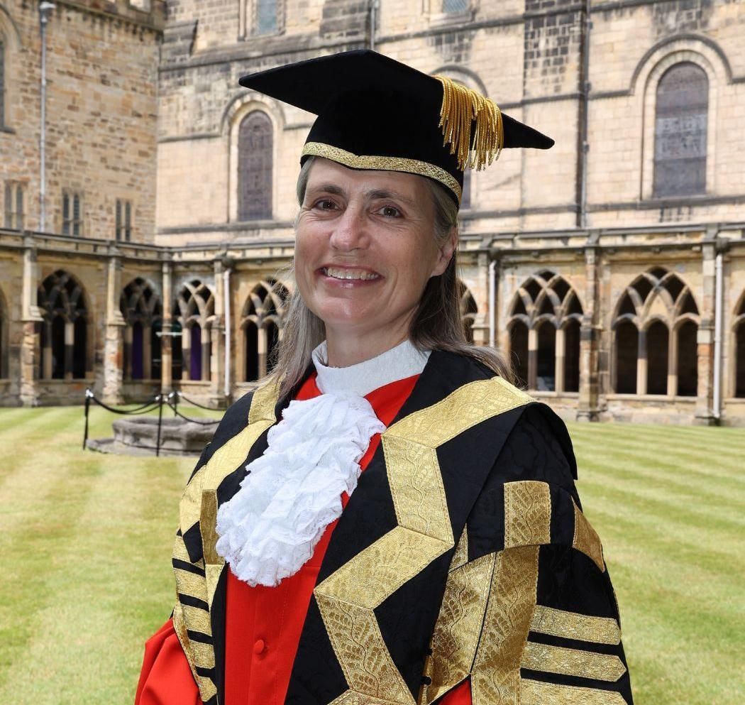 Dr Fiona Hill in academic dress at Durham Cathedral