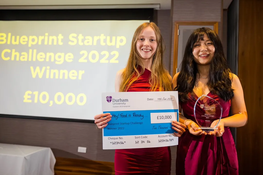 Blueprint winners holding a prize cheque