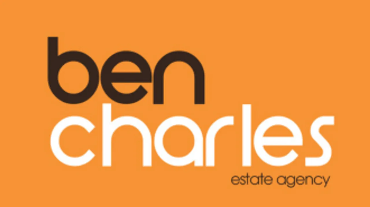 The logo for Ben Charles estate agents, with the name on an orange background.