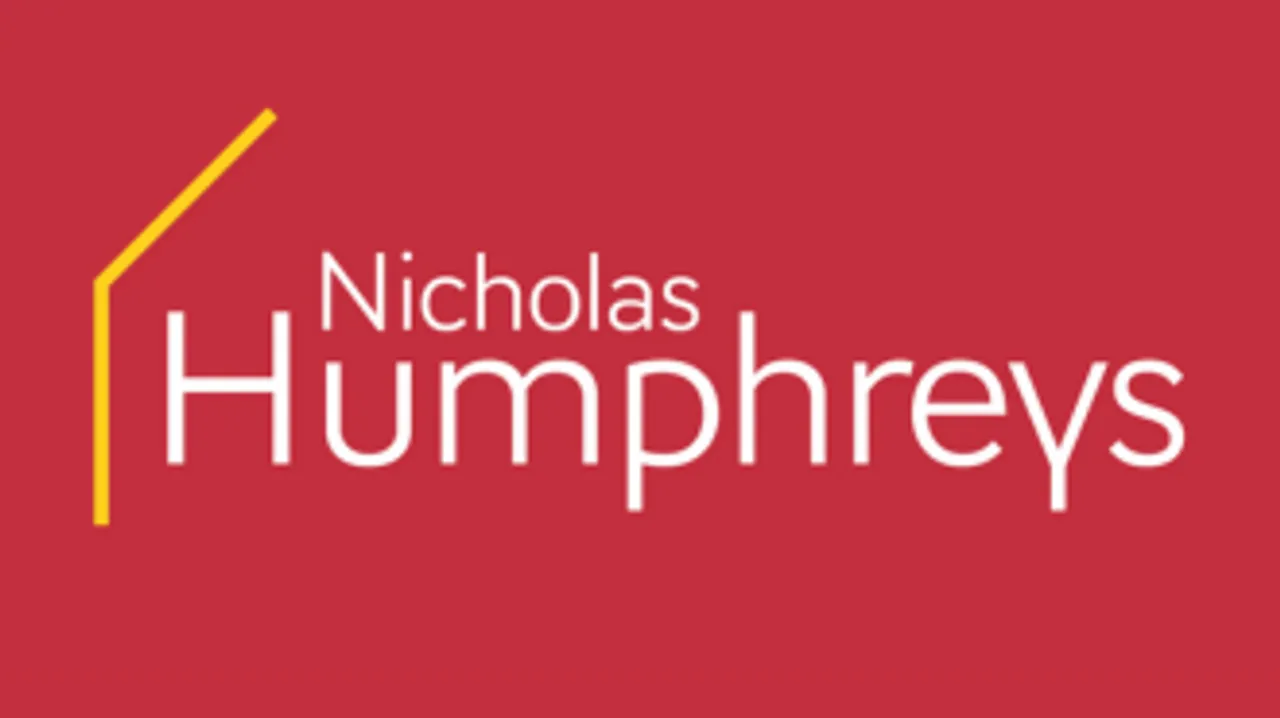 The logo for Nicholas Humphreys estate agents, with their name against a red background with the yellow outline of a house on one side.