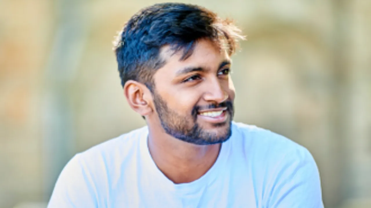 A young man smiling