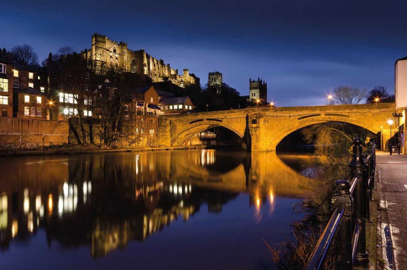 Framwellgate bridge, Durham Castle, and Durham Cathedral lit up at night