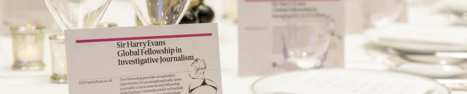 A table setting with wine glasses for the Sir Harry Evans Fellowship Lunch