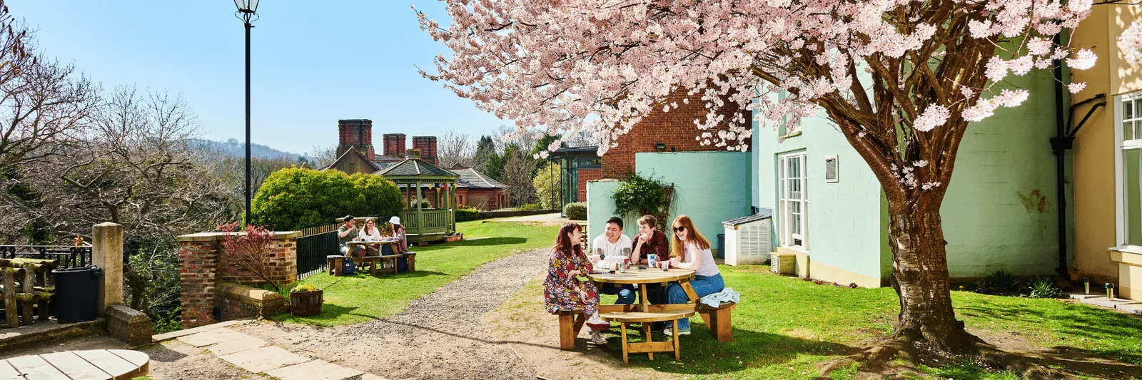 Students sitting outside St Johns College
