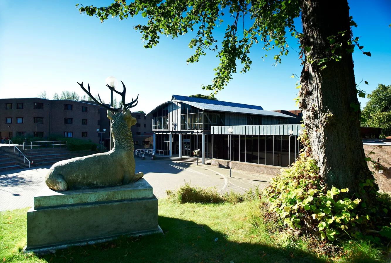 Collingwood College external view with stag statue