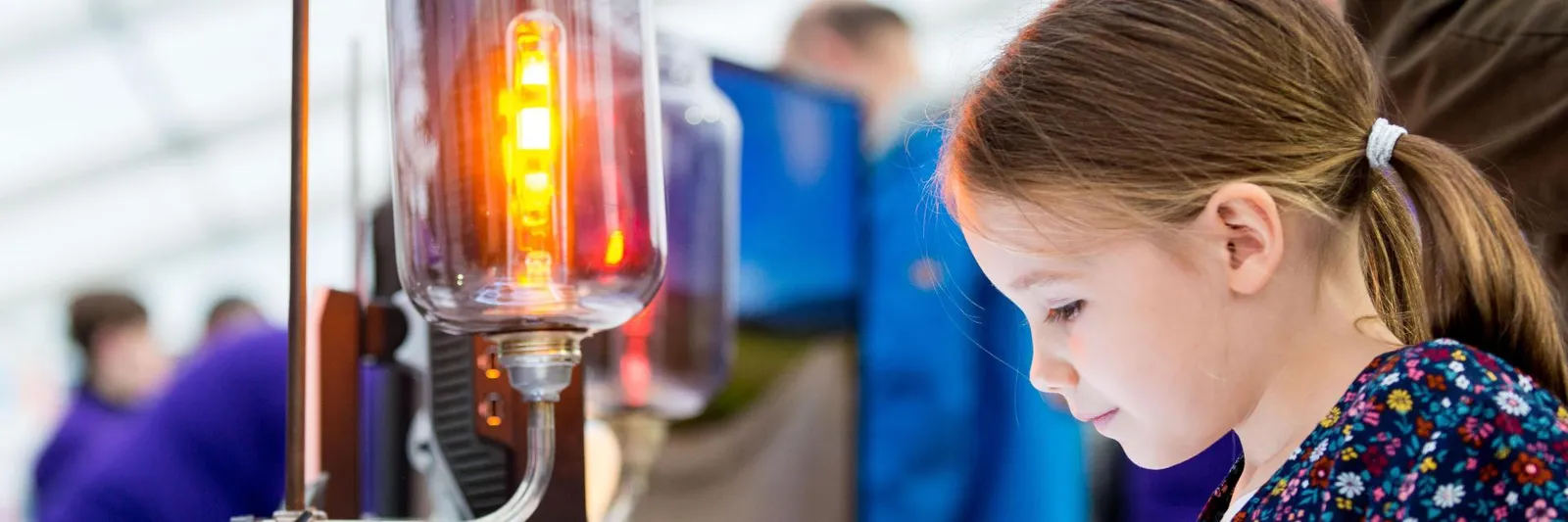 A little girl testing an experiment
