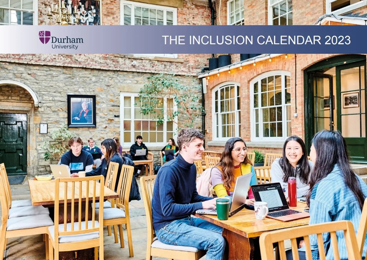 Small groups of students sitting in a courtyard