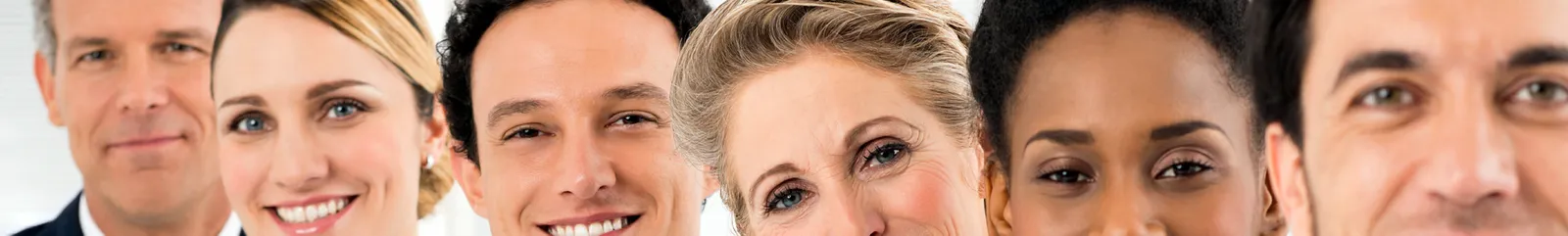 A row of smiling businessmen and women