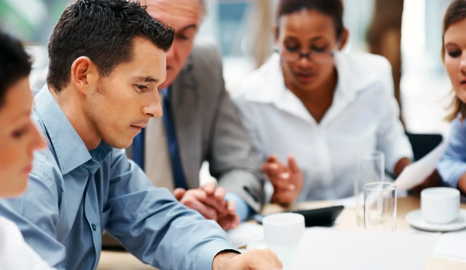 Multi ethnic business people discussing work