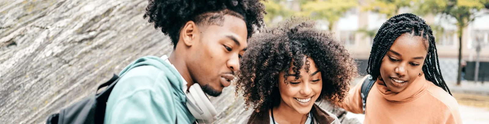 Three students on a campus