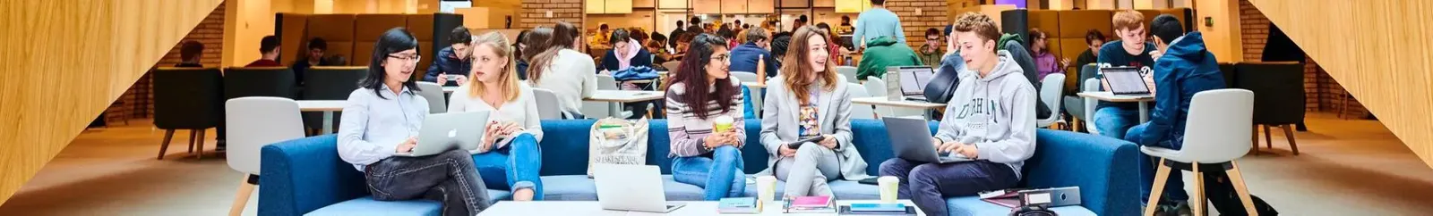 Large group of students socialising in the Teaching and Learning Centre