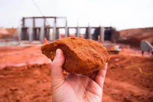 a hand holding soil