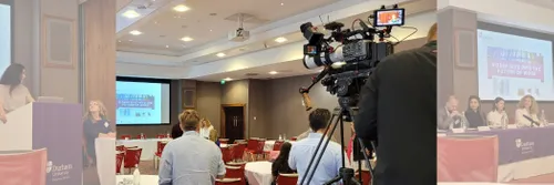 Camera crew at research dissemination event