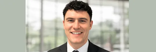 headshot of male student smiling to camera