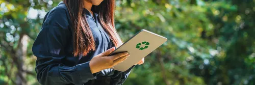 Business woman using table to analyse sustainable development goals (SDGs)