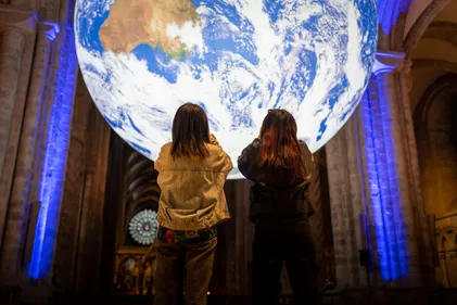 Image of the Gaia installation at Durham Cathedral with Children in the front.