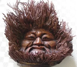 A face carved from wood.