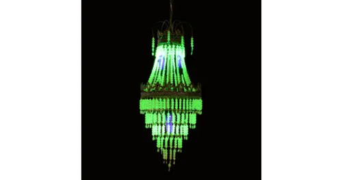 A glowing green chandelier light on display at the Oriental Museum
