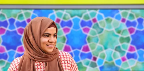 Artist Samira Mian with her colourful geometric artwork