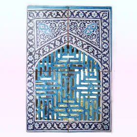 Islamic style window grille made from blue and turquoise ceramic tiles.