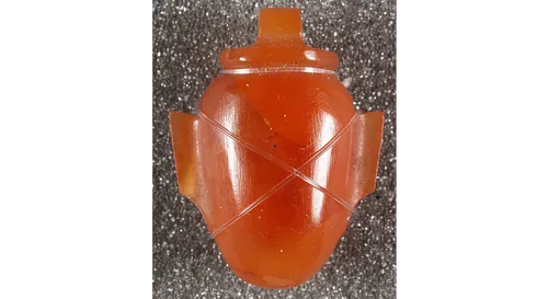 Image of an orange amulet