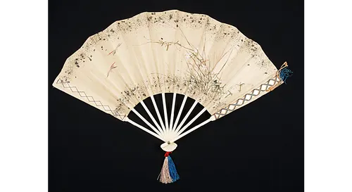 Japanese folding fan. The scene shows dragon flies, flowers and grasses.