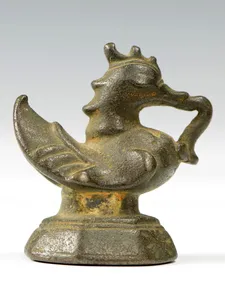 Bronze statue of a Hintha Bird, ornate bird with closed eyes and spiked ridged back