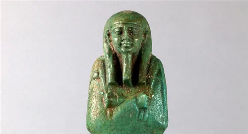 Image of Ancient Egyptian Shabti figurine made of clay and covered in fiance