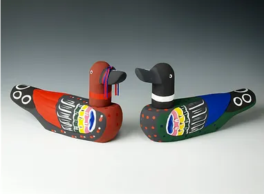 Korean wooden wedding ducks, painted. The ducks are carved from wood, have a flat base and an independently movable head which turns from side to side. The ducks are completely painted aside from the base which has a column of Korean hanja stamped in blue ink which describes the makers details.