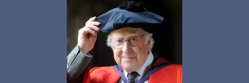 Peter Higgs in a gown in 2013 on the day he received his honorary degree