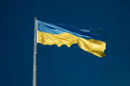 A Ukraine flag fluttering on a pole