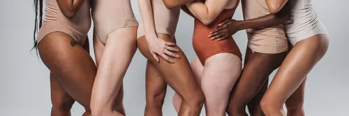 Diverse group of women in underwear in a line showing torso and upper legs only