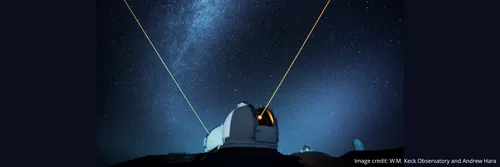 Keck Observatory in Hawaii, taken at night with lasers shining into the sky
