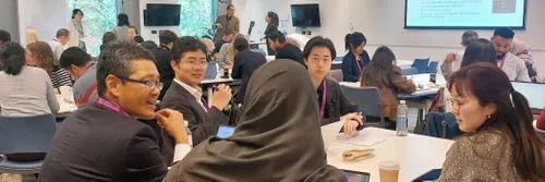 People sitting around a table, workshopping