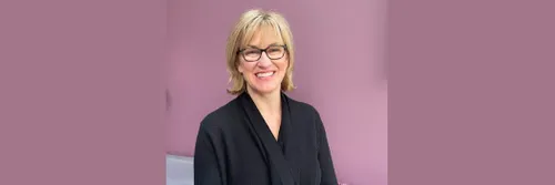 A picture of Professor Clare McGlynn against a pink/purple backdrop