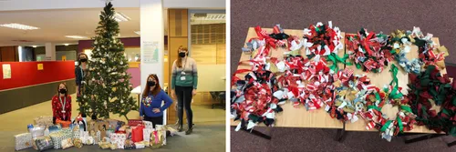Staff standing next to a Christmas tree with presents underneath. On the right are Christmas crafts made by our students.