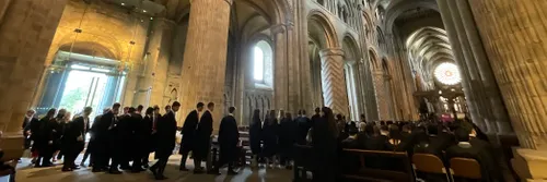 Students filing into the Cathedral in gowns