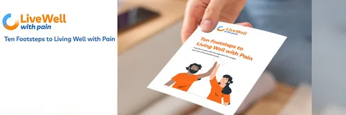 A hand holding a Live Well With Pain leaflet