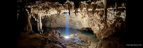 Tourists explore the ‘Dome of the Cathedral’, the largest chamber in Grutas Tzabnah (Yucatán, Mexico), and the origin of Tzab06-1. The artificial well ‘La Noria’ now illuminates the cave.