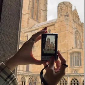 An image showing a camera taking a photograph of the cathedral