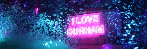 A Lumiere installation that spells out 'I love Durham' in pink neon lights