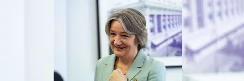 Professor Karen O'Brien smiling wearing a light green blazer