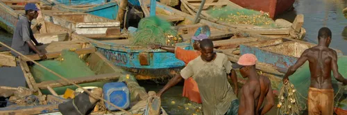 Men working at a Ghanaian fishing port