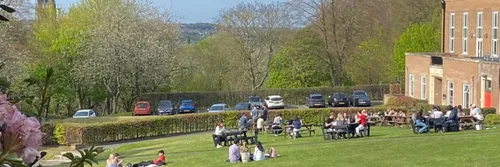 Students on lawn in front of college