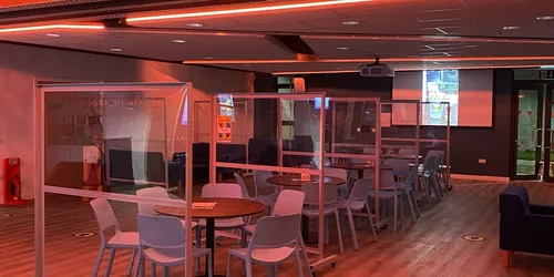 A picture of the cafe and bar with orange lights