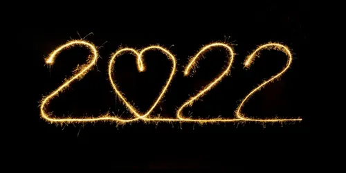 2022 written in gold on a black background. The 