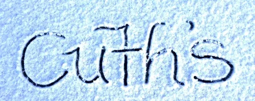 The word CUTH’S written in the snow.