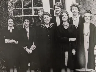 black and white photo of 8 women