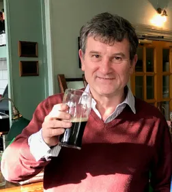 A man rises a pint